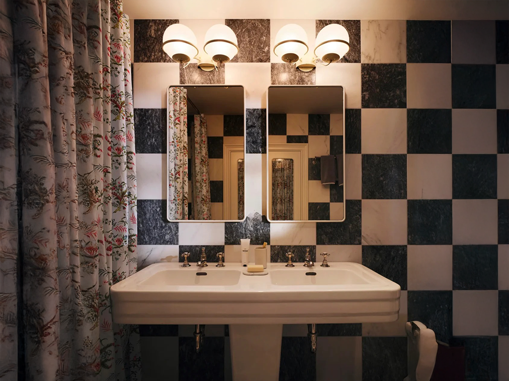 Vintage Globe Sconces Transform a Classic Bathroom