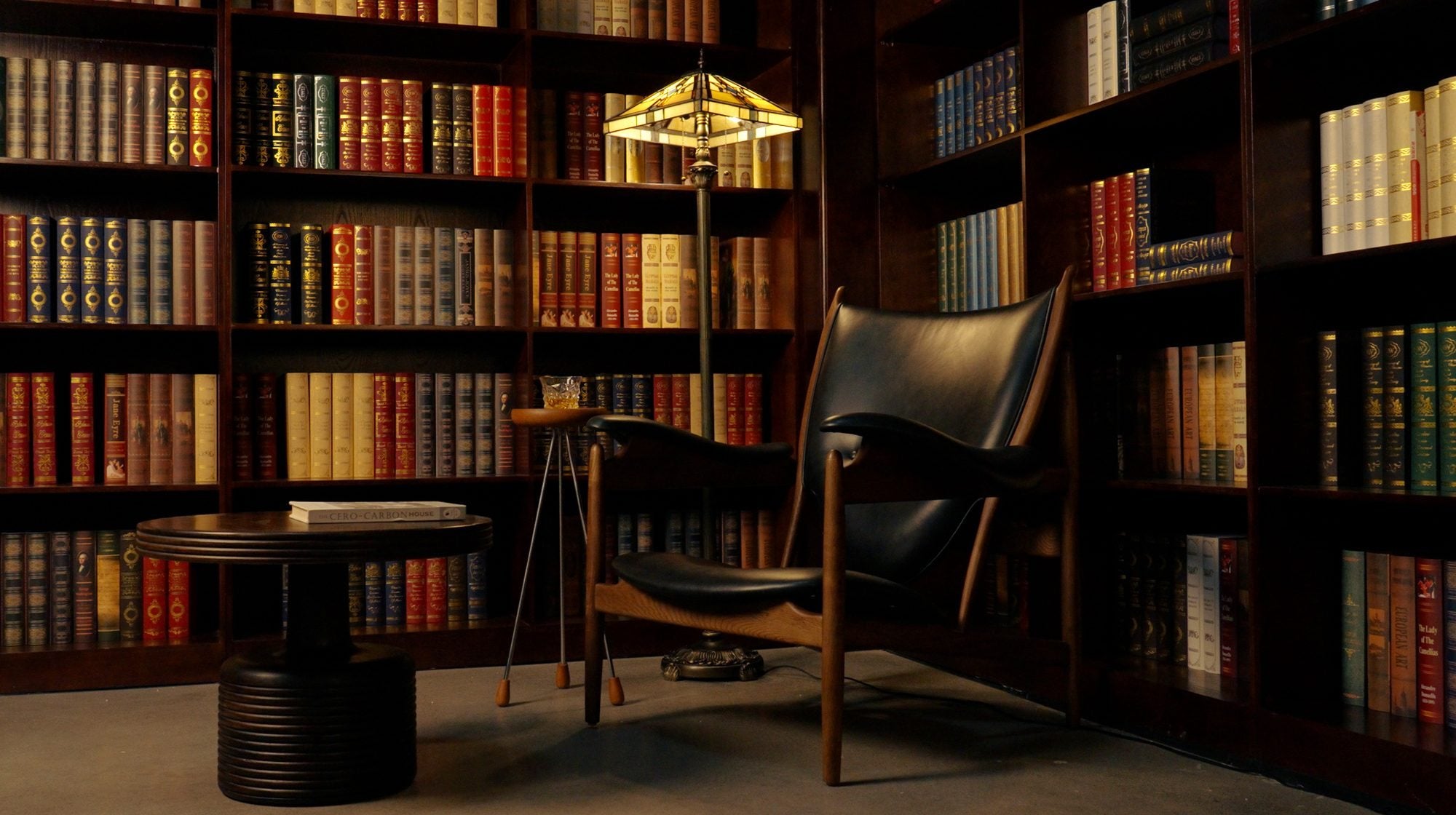 HERO — brass pipe pendants over a restaurant bar, warm evening install