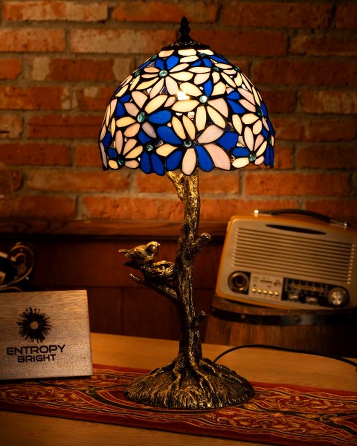 TIFFANY LAMPS — statement pendant, lit, showing colored glass panels